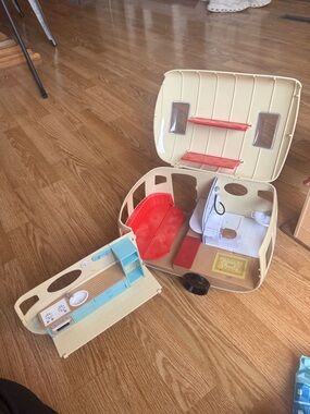 Cream Toy Caravan with Red Interior and Green Wheel Accent